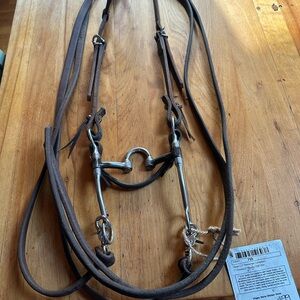 Leather one ear head stall with bit and 7ft split reins…